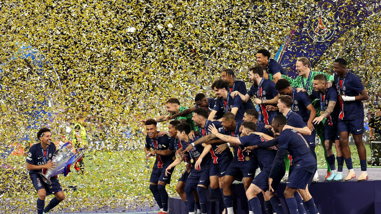 Marquinhos prepares to lift the trophy after Paris St-Germain's beat Inter Milan to win the Champions League for the first time