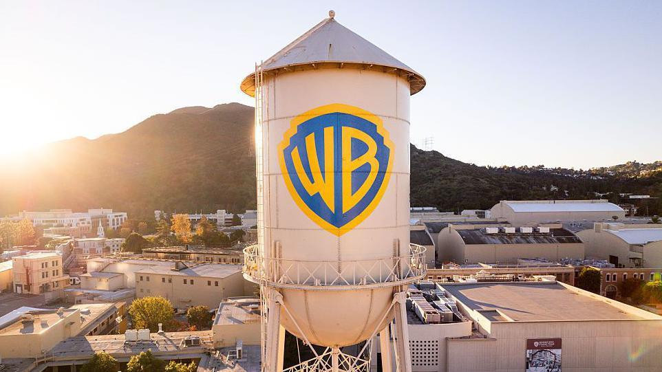The Warner Bros logo is displayed on the water tower 